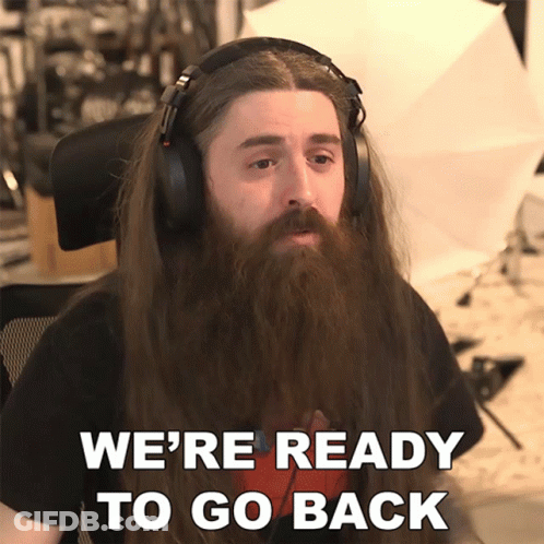 A Man With Long Hair And A Beard Is Wearing Headphones And Says We 'Re Ready To Go Back GIF
