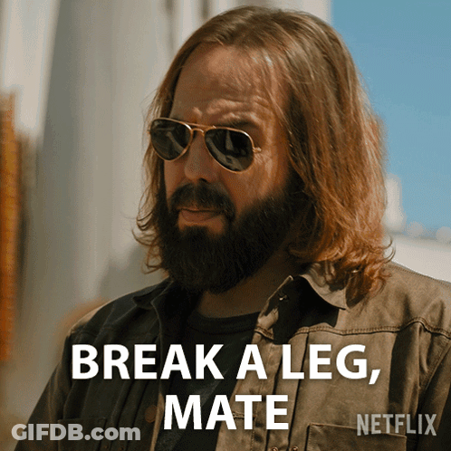 A Man With Long Hair And A Beard Is Wearing Sunglasses And Says " Break A Leg Mate " GIF