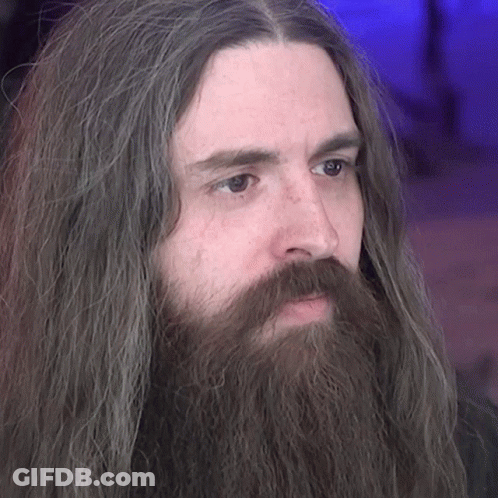 Man With Long Hair And Beard Looking Left GIF