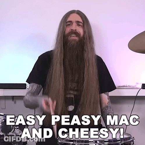 A Man With Long Hair And A Beard Playing Drums With The Words Easy Peasy Mac And Cheesy Below Him GIF