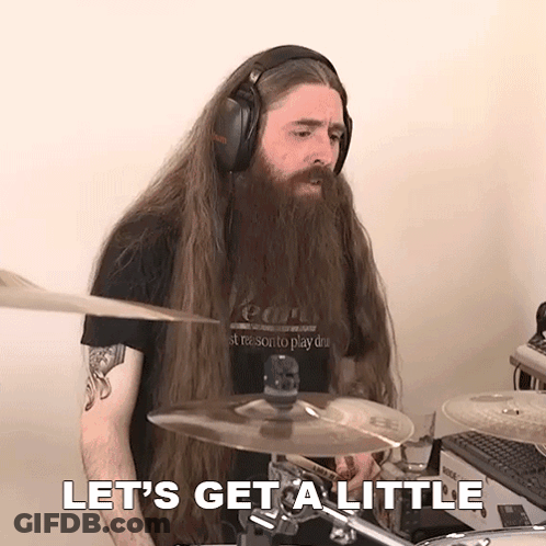 A Man With Long Hair And A Beard Playing Drums With The Words Let 'S Get A Little Behind Him GIF