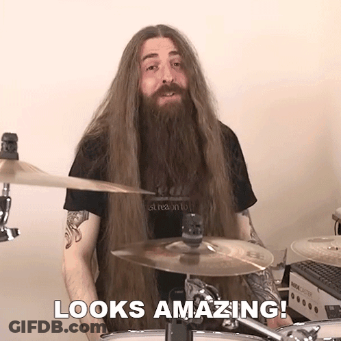 Man With Long Hair And Beard Playing Drums GIF