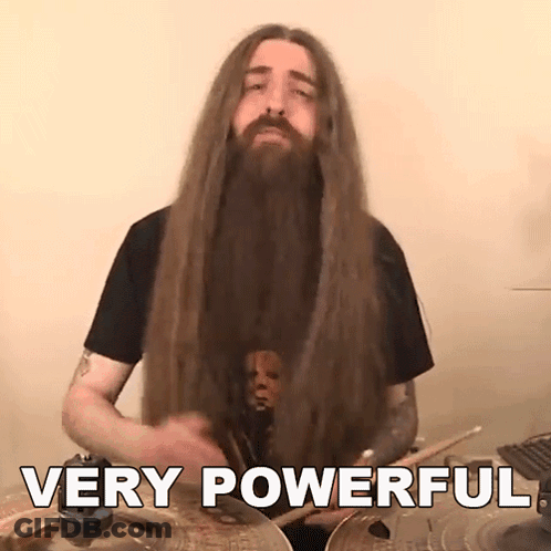 A Man With Long Hair And A Beard Playing Drums With The Words Very Powerful Behind Him GIF