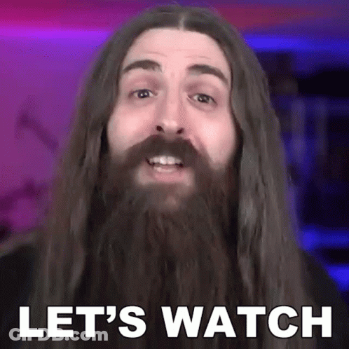 A Man With Long Hair And A Beard Saying Let 'S Watch GIF