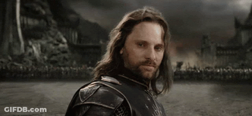 A Man With Long Hair And A Beard Says " Yolo " In White Letters GIF