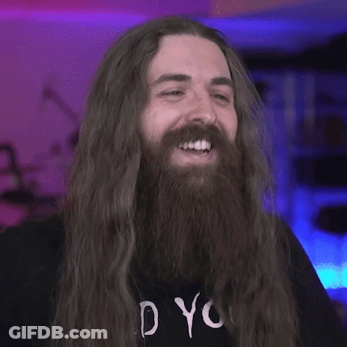 A Man With Long Hair And A Beard Wearing A Shirt That Says " Do You " GIF