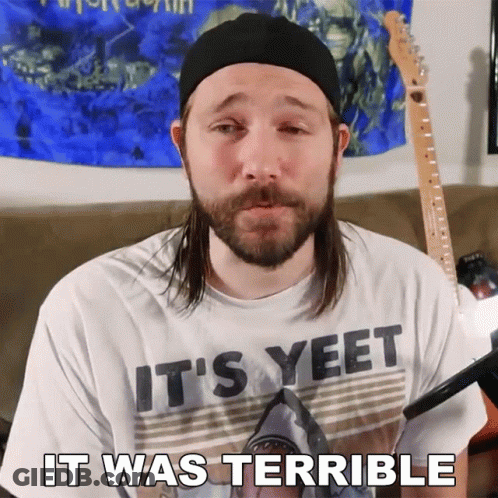 A Man With Long Hair And A Beard Wearing A Shirt That Says It 'S Yeet GIF