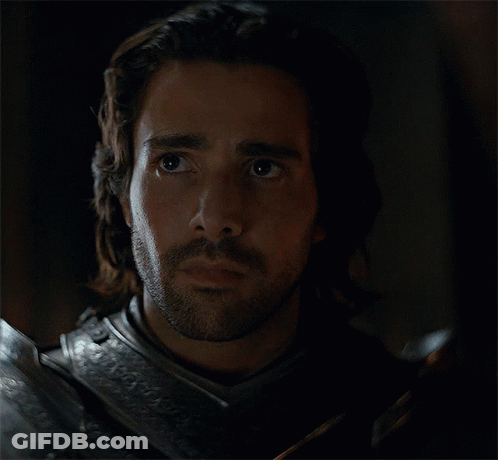 A Man With Long Hair And A Beard Wearing Armor GIF
