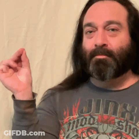A Man With Long Hair And A Beard Wears A Shirt That Says Jinx On It GIF