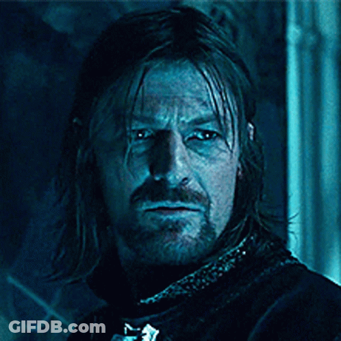 A Man With Long Hair And A Beard With The Words Blue Is Coming On His Face GIF