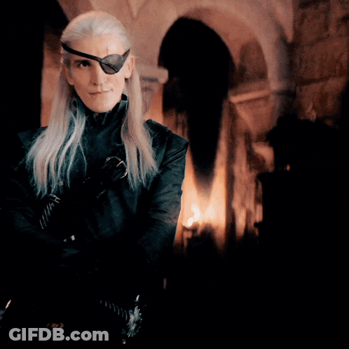 A Man With Long Hair And A Eye Patch On His Eye GIF
