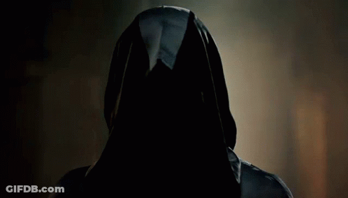 A Man With Long Hair And A Mustache Is Wearing A Cape GIF