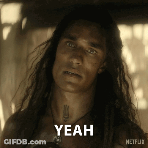 A Man With Long Hair And A Tattoo On His Neck Says " Yeah " GIF