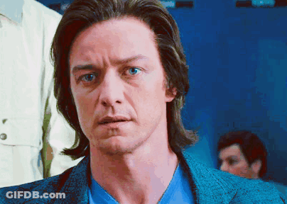 A Man With Long Hair And Blue Eyes Is Wearing A Blue Jacket And Blue Shirt GIF
