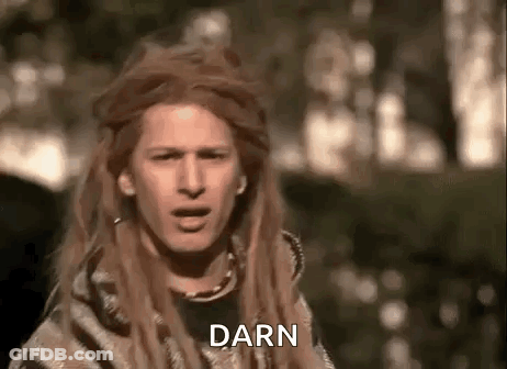 Man With Long Hair And Dreadlocks Making Face In Blanket GIF