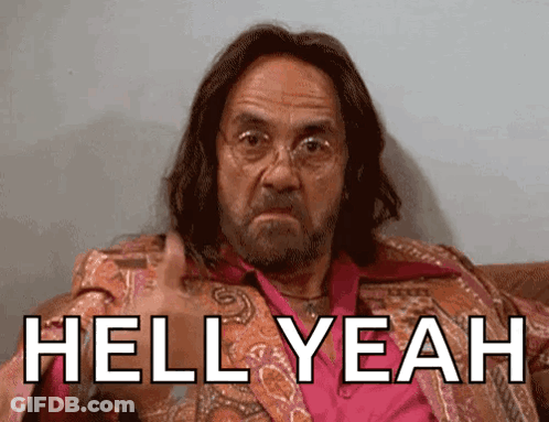 A Man With Long Hair And Glasses Is Sitting On A Couch With The Words Hell Yeah Above Him GIF