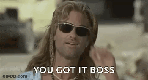 A Man With Long Hair And Sunglasses Is Talking About Getting A Job . GIF