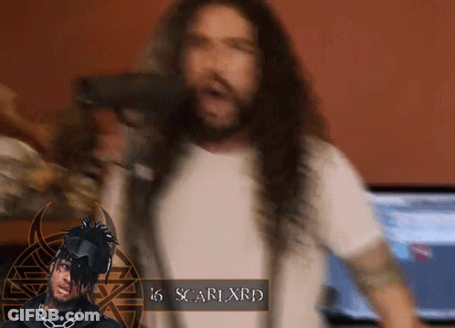 A Man With Long Hair And The Name Scarlxrd GIF