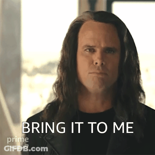 A Man With Long Hair Has The Words Bring It To Me Written On His Face GIF
