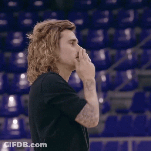 A Man With Long Hair Is Giving A Thumbs Up GIF