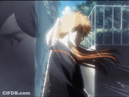 A Man With Long Hair Is Holding A Sword In His Hand GIF