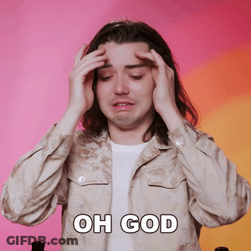 A Man With Long Hair Is Holding His Head With The Words Oh God Written Above Him GIF