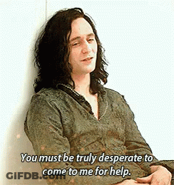 A Man With Long Hair Is Leaning Against A Wall And Saying You Must Be Truly Desperate To Come To Me For Help . GIF