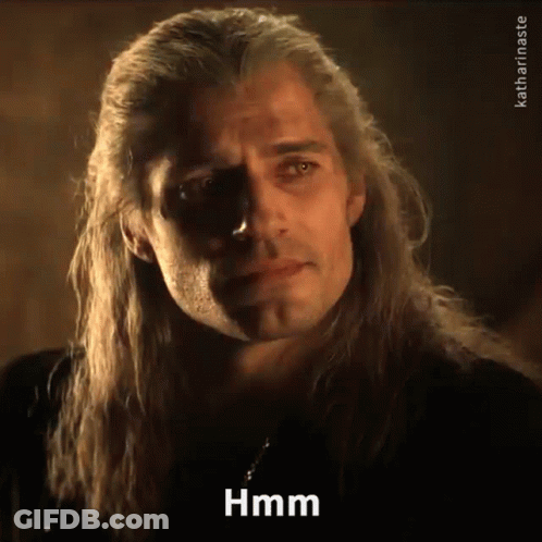 A Man With Long Hair Is Making A Funny Face And Saying Hmm GIF