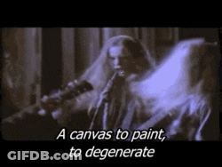 A Man With Long Hair Is Playing A Guitar And Says " A Canvas To Paint To Degenerate " . GIF