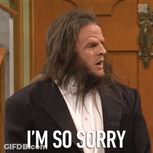 A Man With Long Hair Is Saying I 'M So Sorry In Front Of A Door GIF