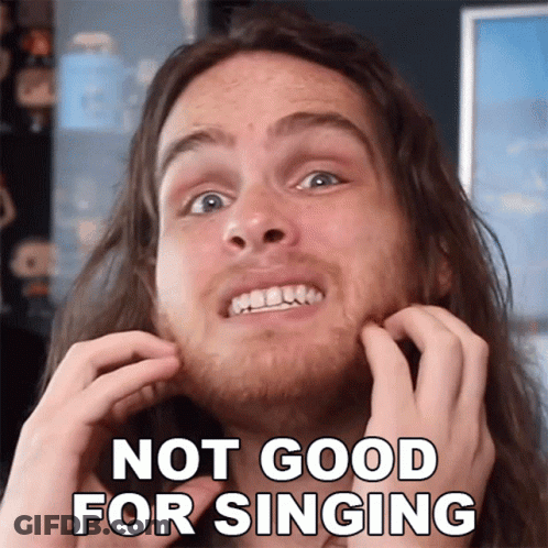 A Man With Long Hair Is Scratching His Face With The Words Not Good For Singing GIF