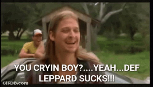 A Man With Long Hair Is Sitting In A Car And Says You Cryin Boy Yeah Def Leppard Sucks ! GIF