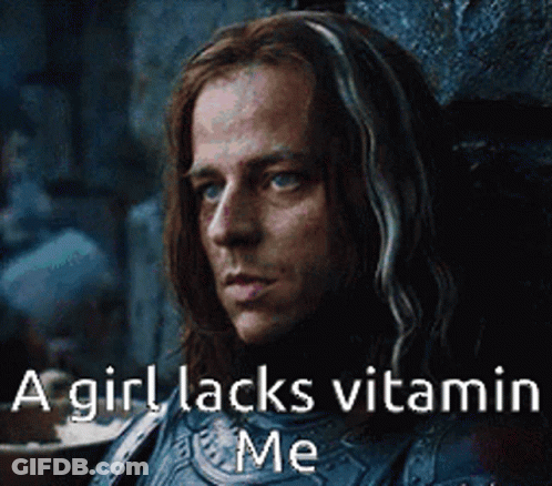 A Man With Long Hair Is Sitting In A Chair With A Caption That Says A Girl Lacks Vitamin Me . GIF
