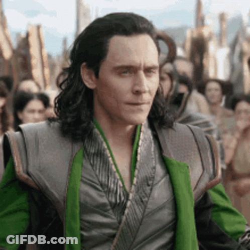 A Man With Long Hair Is Standing In Front Of A Crowd . GIF