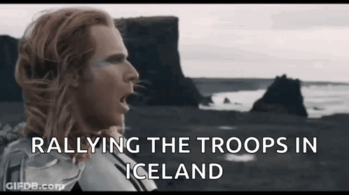 A Man With Long Hair Is Standing In Front Of A Rocky Cliff And The Words Rallying The Troops In Iceland GIF