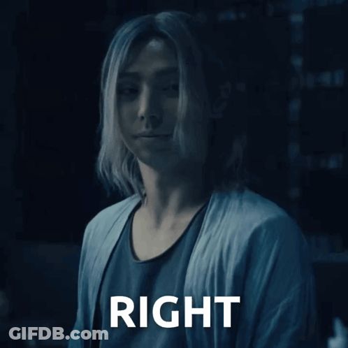 A Man With Long Hair Is Standing Next To A Right Sign GIF