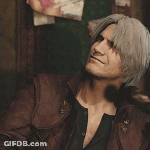 A Man With Long Hair Is Talking On A Phone GIF