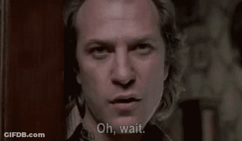 A Man With Long Hair Is Talking To A Woman And Asking Her If She Is A Great , Big , Fat Person . GIF