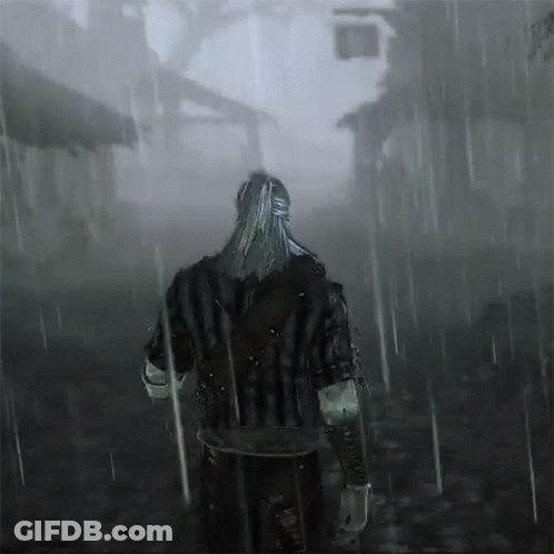 A Man With Long Hair Is Walking Through The Rain GIF