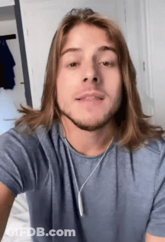 Man With Long Hair Wearing Blue Shirt GIF