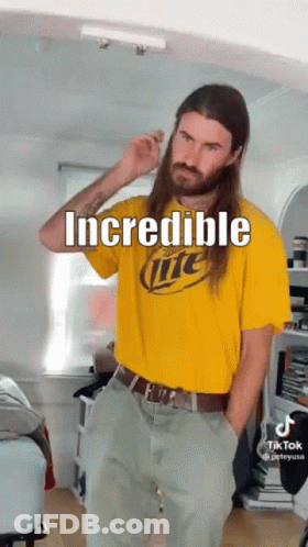 A Man With Long Hair Is Wearing A Miller Lite T-Shirt GIF