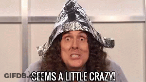 A Man With Long Hair Is Wearing A Tin Foil Hat And Says `` Seems A Little Crazy '' . GIF