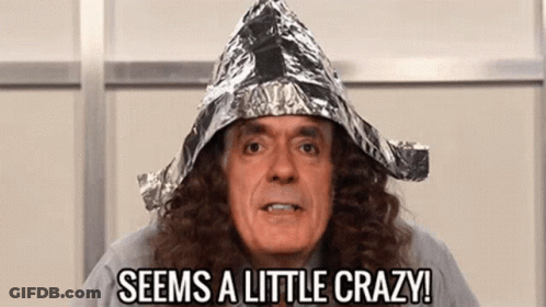 A Man With Long Hair Is Wearing A Tin Foil Hat And Says `` Seems A Little Crazy '' . GIF