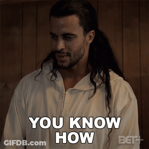 A Man With Long Hair Is Wearing A White Jacket That Says You Know How GIF