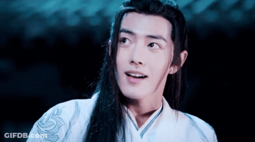 A Man With Long Hair Is Wearing A White Shirt With A Dragon On It GIF