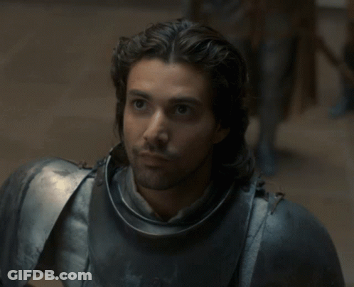 A Man With Long Hair Is Wearing Armor GIF