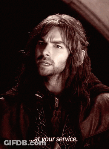 A Man With Long Hair Says " At Your Service " GIF