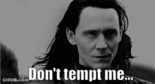 A Man With Long Hair Says " Don 'T Tempt Me " In A Black And White Photo GIF