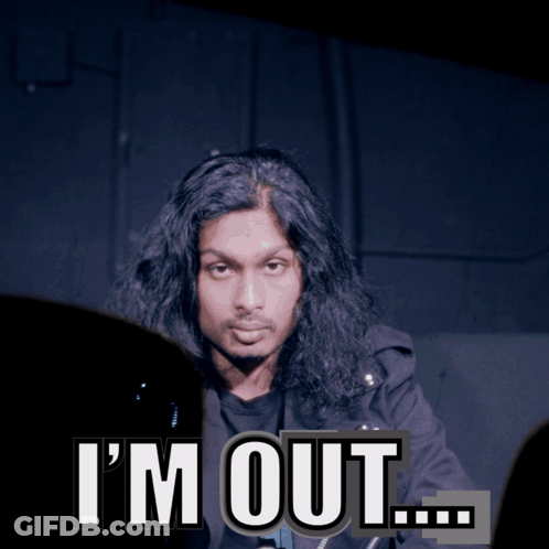A Man With Long Hair Says I 'M Out In Front Of A Dark Background GIF