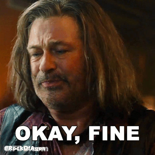 A Man With Long Hair Says " Okay Fine " In Front Of Him GIF